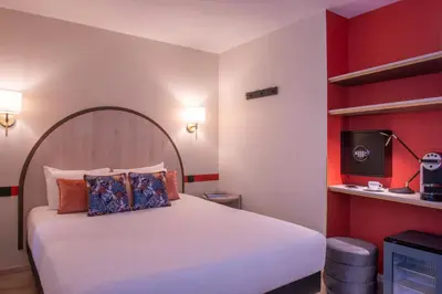 Un ou plusieurs lits dans un hébergement de l'établissement Hotel France Albion