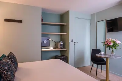 Un ou plusieurs lits dans un hébergement de l'établissement Hotel France Albion