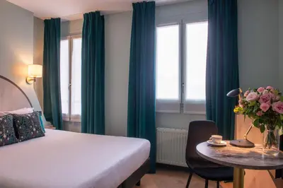 Un ou plusieurs lits dans un hébergement de l'établissement Hotel France Albion
