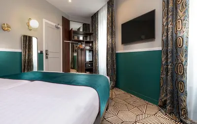 Télévision ou salle de divertissement dans l'établissement Hotel Elysa-Luxembourg