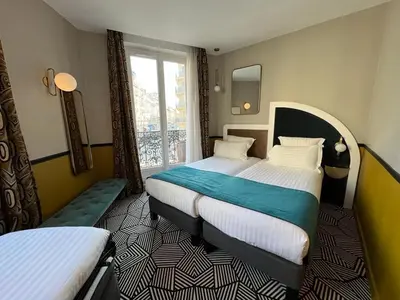 Un ou plusieurs lits dans un hébergement de l'établissement Hotel Elysa-Luxembourg