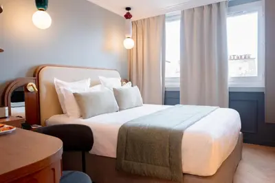 Un ou plusieurs lits dans un hébergement de l'établissement Grand Hotel Saint Michel