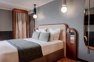 Un ou plusieurs lits dans un hébergement de l'établissement Grand Hotel Saint Michel