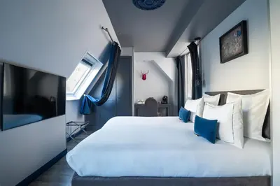 Un ou plusieurs lits dans un hébergement de l'établissement Hotel Mademoiselle