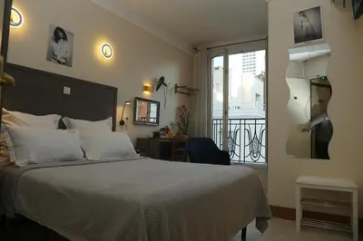 Un ou plusieurs lits dans un hébergement de l'établissement Hotel Novex Paris