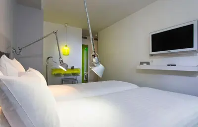 Un ou plusieurs lits dans un hébergement de l'établissement Color Design Hotel