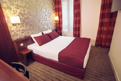 Un ou plusieurs lits dans un hébergement de l'établissement Timhotel Paris Gare de Lyon