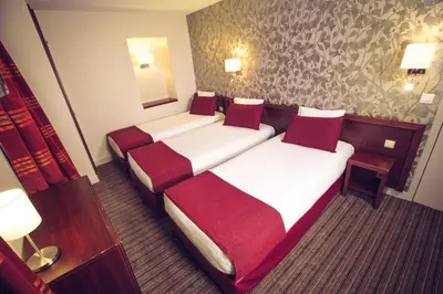 Un ou plusieurs lits dans un hébergement de l'établissement Timhotel Paris Gare de Lyon