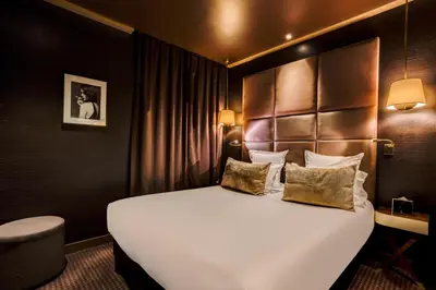 Un ou plusieurs lits dans un hébergement de l'établissement Hotel Armoni Paris