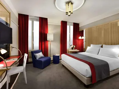 Un ou plusieurs lits dans un hébergement de l'établissement l'Echiquier Opéra Hotel Paris - MGallery Collection