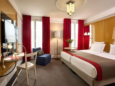 Un ou plusieurs lits dans un hébergement de l'établissement l'Echiquier Opéra Hotel Paris - MGallery Collection