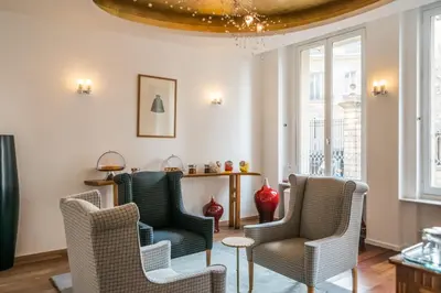 Coin salon dans l'établissement Hotel Lorette - Astotel
