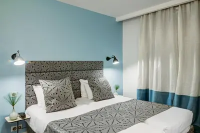 Un ou plusieurs lits dans un hébergement de l'établissement Hotel Astoria - Astotel