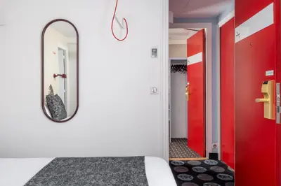 Un ou plusieurs lits dans un hébergement de l'établissement Hotel Astoria - Astotel