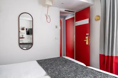 Un ou plusieurs lits dans un hébergement de l'établissement Hotel Astoria - Astotel
