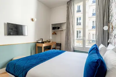 Un ou plusieurs lits dans un hébergement de l'établissement Hotel Acadia - Astotel