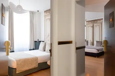 Un ou plusieurs lits dans un hébergement de l'établissement Hotel Malte - Astotel