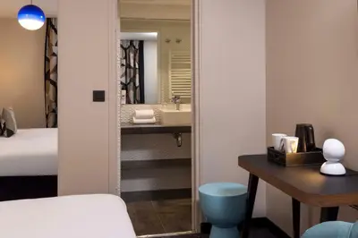 Un ou plusieurs lits dans un hébergement de l'établissement Hôtel Regina Opéra Grands Boulevards