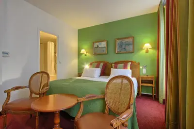 Un ou plusieurs lits dans un hébergement de l'établissement Timhotel Invalides Eiffel