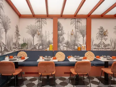 Coin salon dans l'établissement Hôtel Biskui