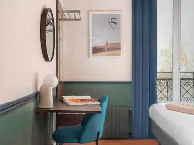 Un ou plusieurs lits dans un hébergement de l'établissement Hôtel Biskui