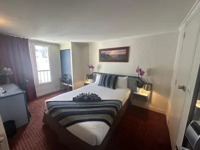 Un ou plusieurs lits dans un hébergement de l'établissement Hôtel Opera Deauville