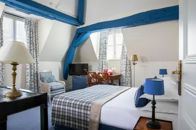 Un ou plusieurs lits dans un hébergement de l'établissement Le Relais Saint Honoré
