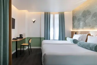 Un ou plusieurs lits dans un hébergement de l'établissement Hôtel WYLD Saint Germain