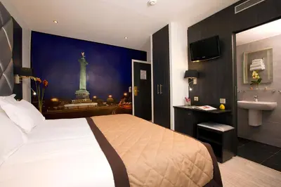 Un ou plusieurs lits dans un hébergement de l'établissement Hôtel Eden Opéra