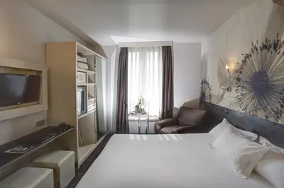 Un ou plusieurs lits dans un hébergement de l'établissement Hotel Vivaldi