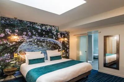Un ou plusieurs lits dans un hébergement de l'établissement Hôtel Mercure Paris Suresnes Longchamp