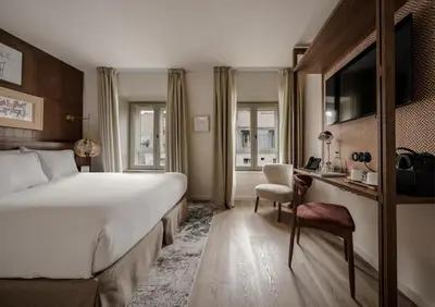 Un ou plusieurs lits dans un hébergement de l'établissement Hotel Pulitzer Paris
