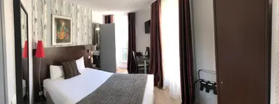 Un ou plusieurs lits dans un hébergement de l'établissement Hôtel Alane