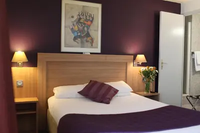 Un ou plusieurs lits dans un hébergement de l'établissement Hôtel Alane