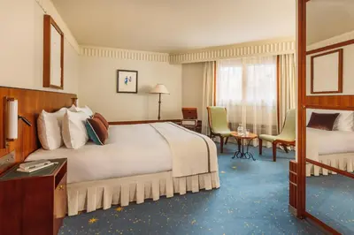Un ou plusieurs lits dans un hébergement de l'établissement Hôtel Des Grands Voyageurs