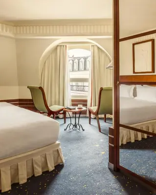 Un ou plusieurs lits dans un hébergement de l'établissement Hôtel Des Grands Voyageurs