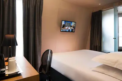 Télévision ou salle de divertissement dans l'établissement Best Western Quartier Latin Pantheon