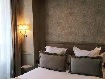 Un ou plusieurs lits dans un hébergement de l'établissement Hôtel George Washington