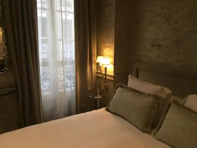 Un ou plusieurs lits dans un hébergement de l'établissement Hôtel George Washington