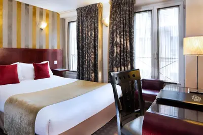 Un ou plusieurs lits dans un hébergement de l'établissement Hotel Opéra d'Antin