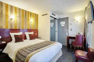 Un ou plusieurs lits dans un hébergement de l'établissement Hotel Opéra d'Antin