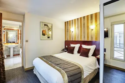 Un ou plusieurs lits dans un hébergement de l'établissement Hotel Opéra d'Antin