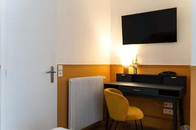 Télévision ou salle de divertissement dans l'établissement Hotel Boileau
