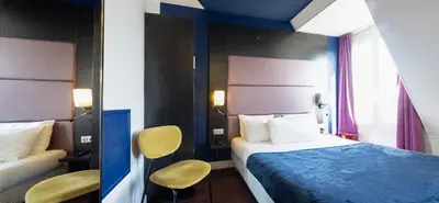 Un ou plusieurs lits dans un hébergement de l'établissement Accueil Hôtel Paris Pigalle Montmartre