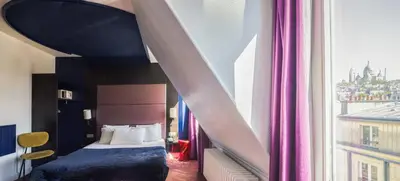 Un ou plusieurs lits dans un hébergement de l'établissement Accueil Hôtel Paris Pigalle Montmartre