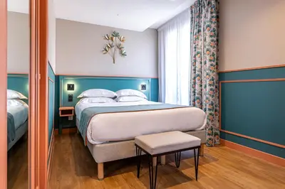 Un ou plusieurs lits dans un hébergement de l'établissement Hôtel Montcalm