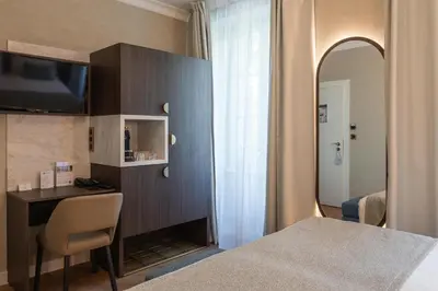Un ou plusieurs lits dans un hébergement de l'établissement Best Western Au Trocadéro