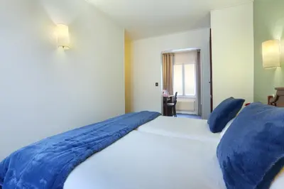 Un ou plusieurs lits dans un hébergement de l'établissement Hotel Beaugrenelle Tour Eiffel