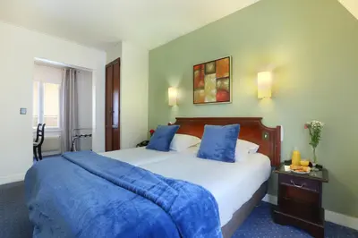Un ou plusieurs lits dans un hébergement de l'établissement Hotel Beaugrenelle Tour Eiffel