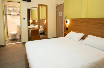 Un ou plusieurs lits dans un hébergement de l'établissement Hôtel de la Terrasse